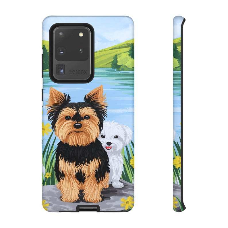 Maltese and Yorkie dog phone case with vibrant lake scene for iPhone, Samsung, and Pixel models.